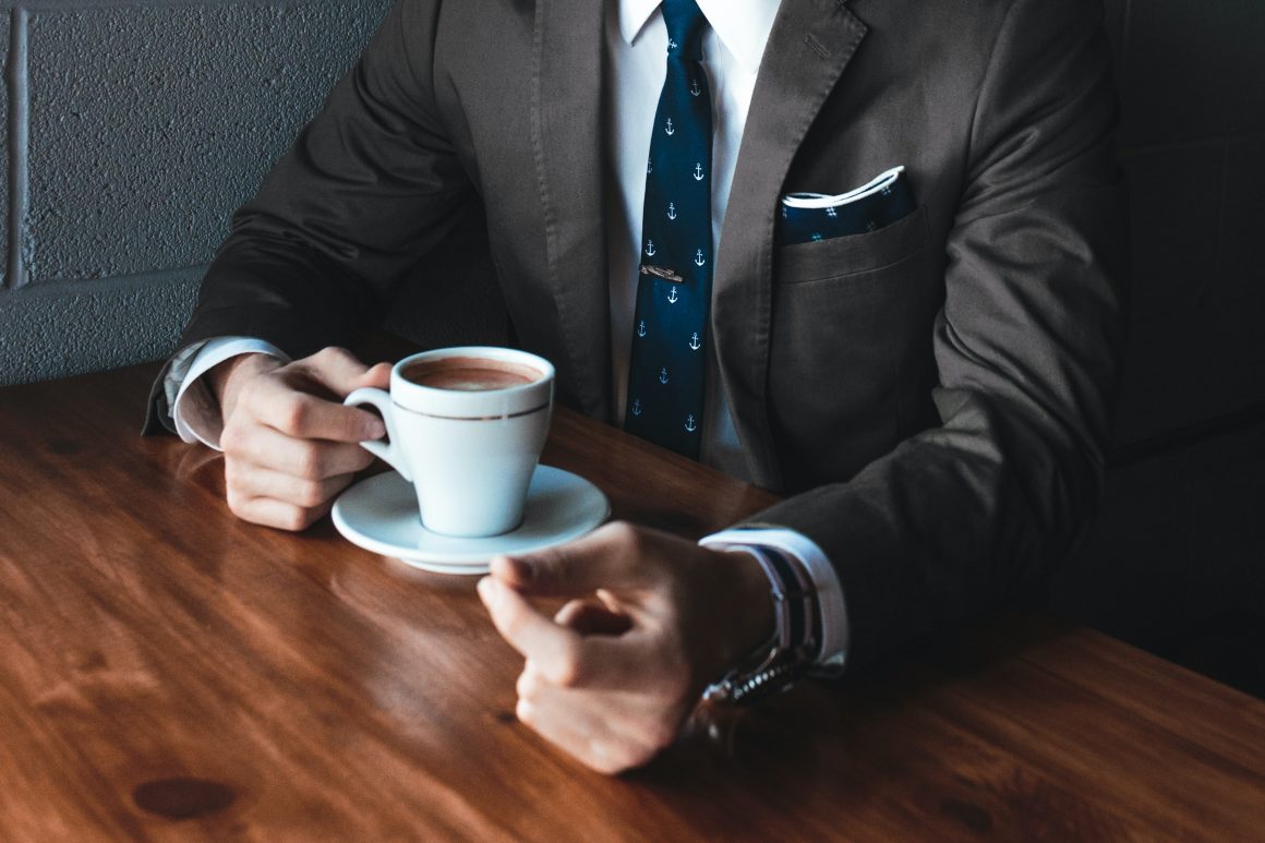 Financial Advisor with cup of coffee