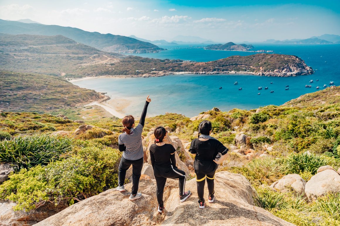 How to Plan for Retirement At Every Stage Of Your Life: Three women on top of the mountain